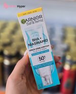 ضد آفتاب فلوئيدي حاوي نياسين آميد و BHA گارنير با SPF50