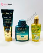 پک ترمیم کننده مو بیوکسین BIOXCIN حاوی کراتین و آرگان (ماسک مو 250 میل+شامپو 300 میل+روغن مو 150 میل)
